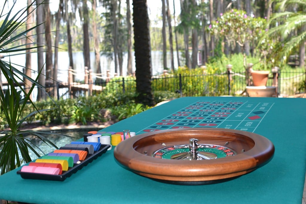 roulette table outside under palm tree