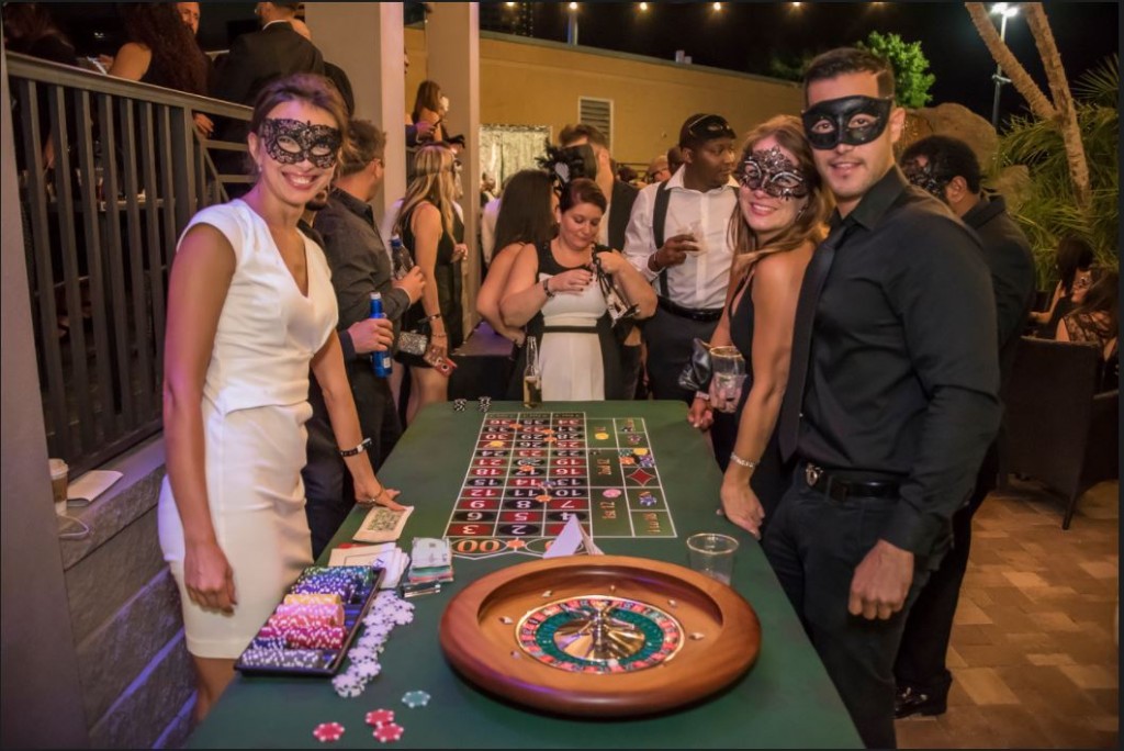 people wearing masks at roulette table