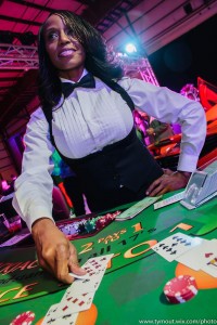 Female black jack dealer laying down cards
