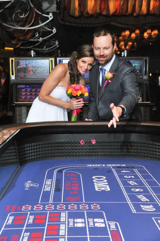 bride and groom playing craps in casino